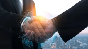Two business professionals shaking hands with digital globe and data overlay, symbolizing global IFRS compliance and corporate partnership
